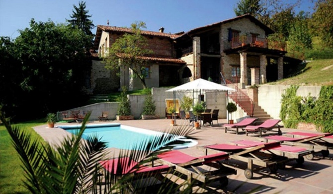 House with large terrace in a small residence with swimming pool surrounded by greenery